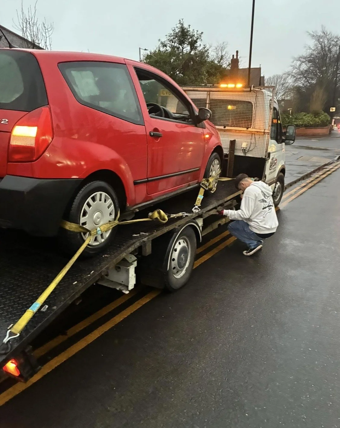 Car being towed by J and R Recovery