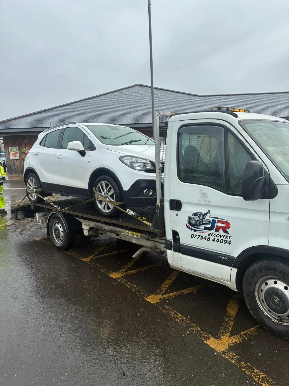 J and R Recovery truck loading a car in Doncaster